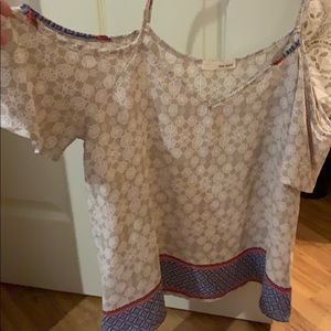 off the shoulder tan and blue shirt